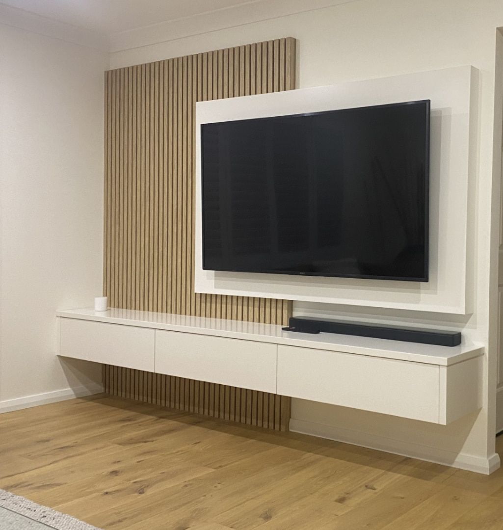 Modern Living Room Wall With Large TV, White Floating Console — JDS Kitchens & Detailed Joinery in Albion Park Rail, NSW