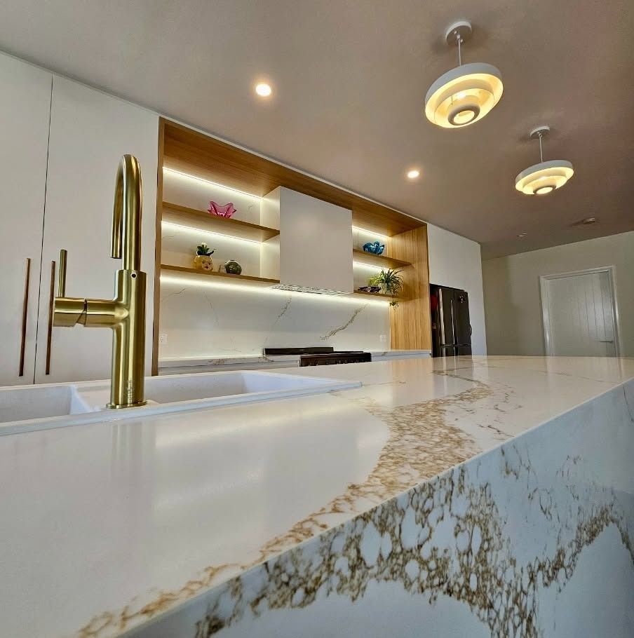 Modern Kitchen with Marble Island, Brass Faucet, Lit Shelves, and Pendant Lights — JDS Kitchens & Detailed Joinery in Albion Park Rail, NSW
