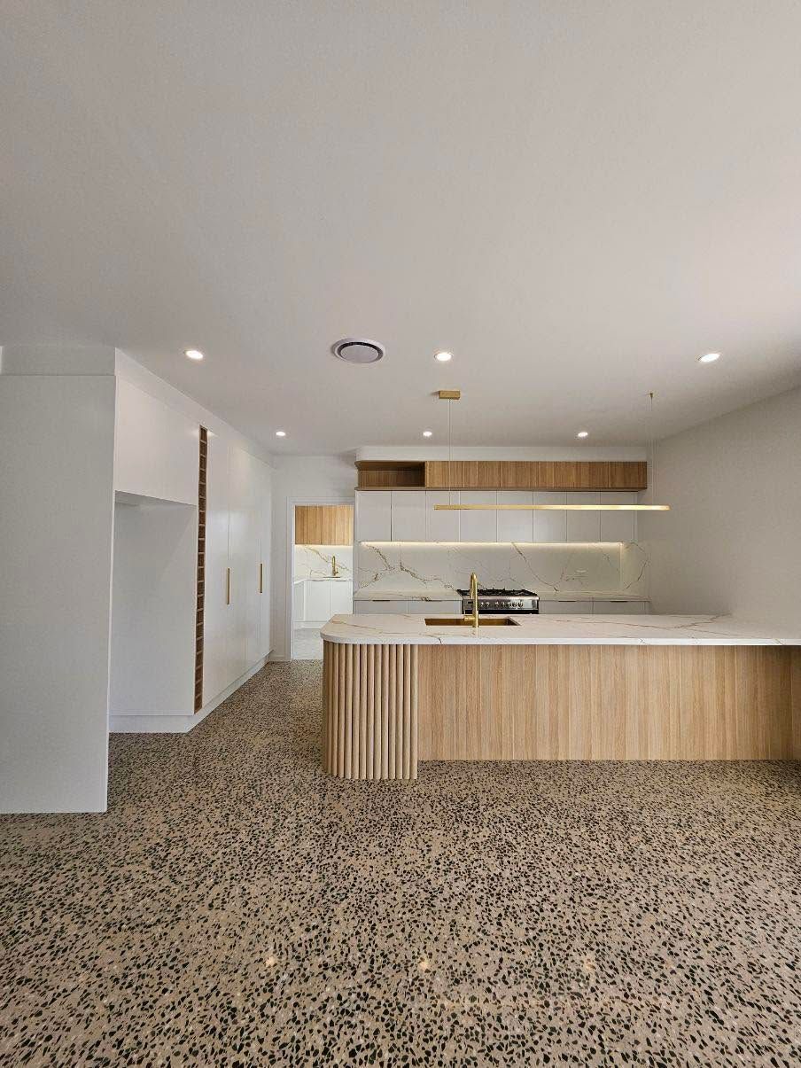 Modern White Kitchen with Wood Island, Patterned Tile Floor, and Recessed Ceiling Lights — JDS Kitchens & Detailed Joinery in Albion Park Rail, NSW
