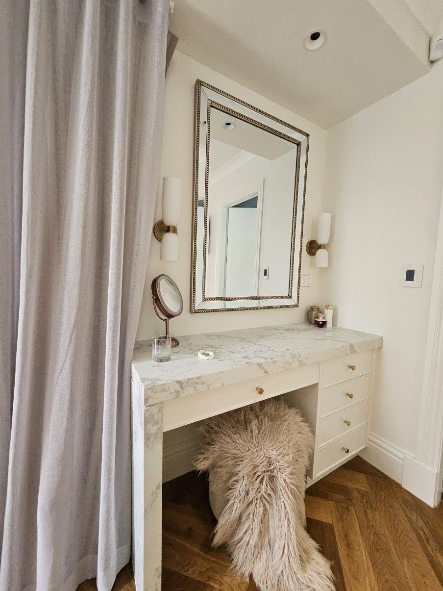 Elegant Vanity Desk with Mirror, Wall Sconces, and Shaggy Stool in A Bright Room — JDS Kitchens & Detailed Joinery in Albion Park Rail, NSW
