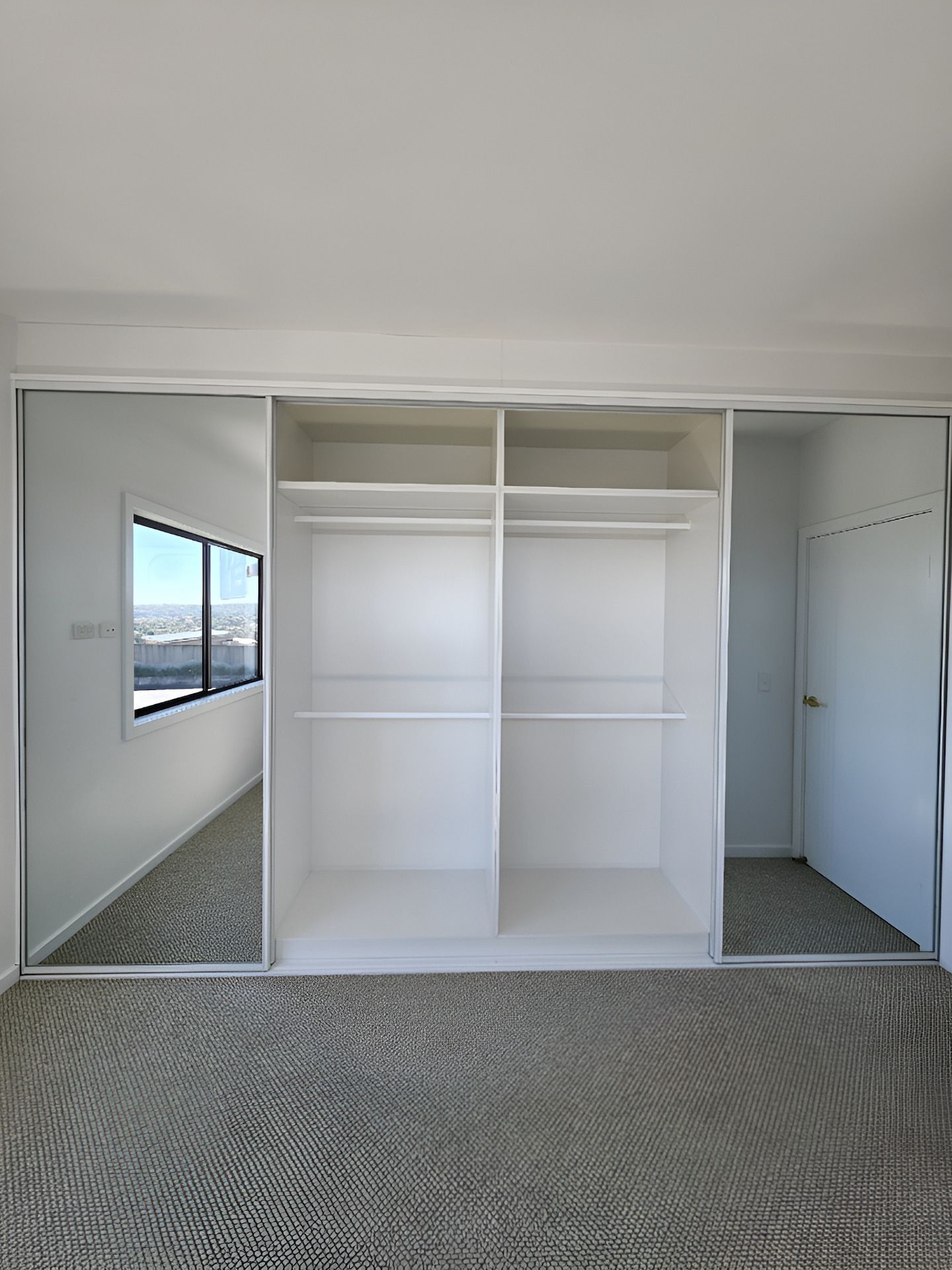 Bedroom With Built-in Closet and Mirrored Sliding Doors — JDS Kitchens & Detailed Joinery in Albion Park Rail, NSW