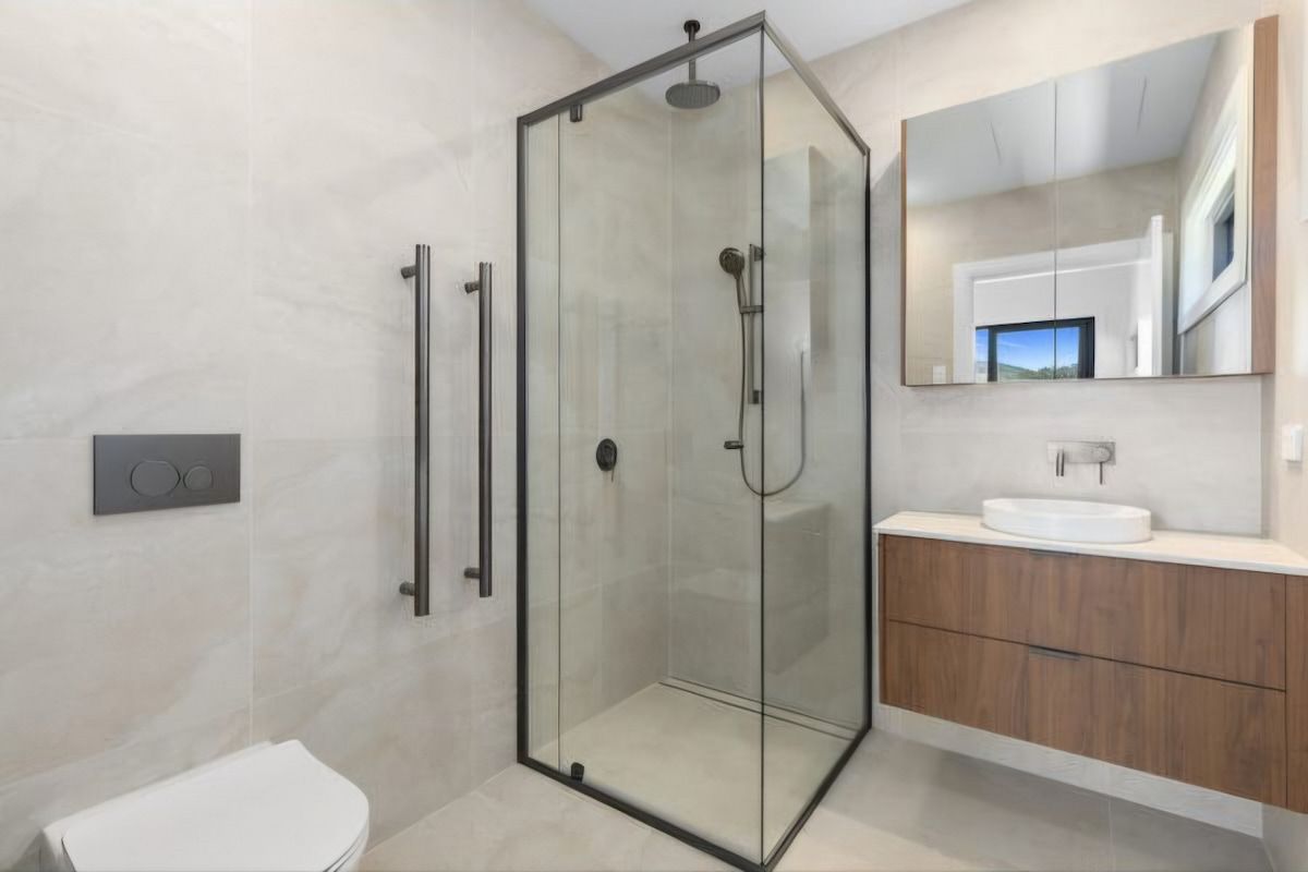 Modern Bathroom With Glass Shower — JDS Kitchens & Detailed Joinery in Albion Park Rail, NSW