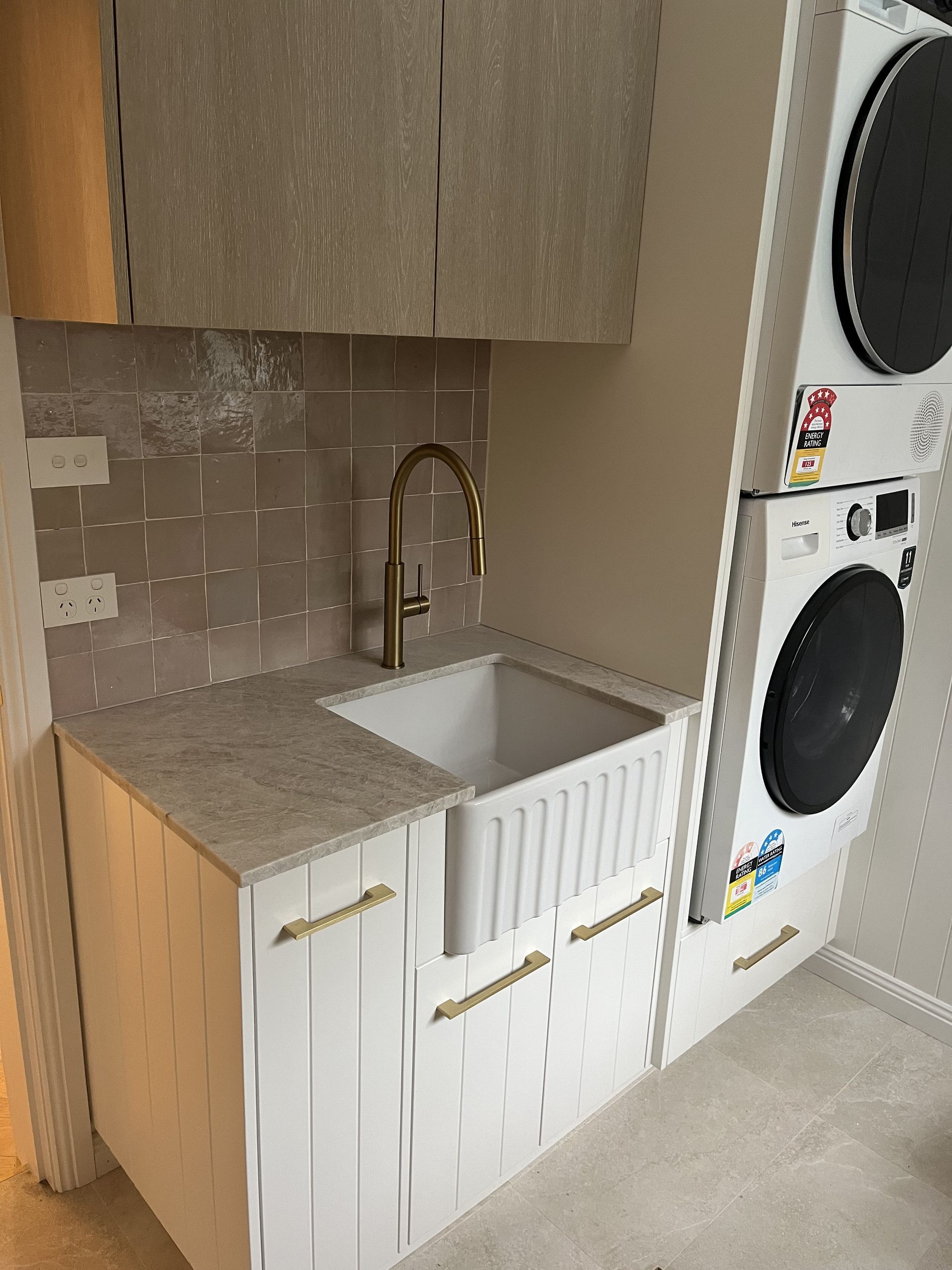 Compact Laundry Room Sink With White Cabinets — JDS Kitchens & Detailed Joinery in Albion Park Rail, NSW