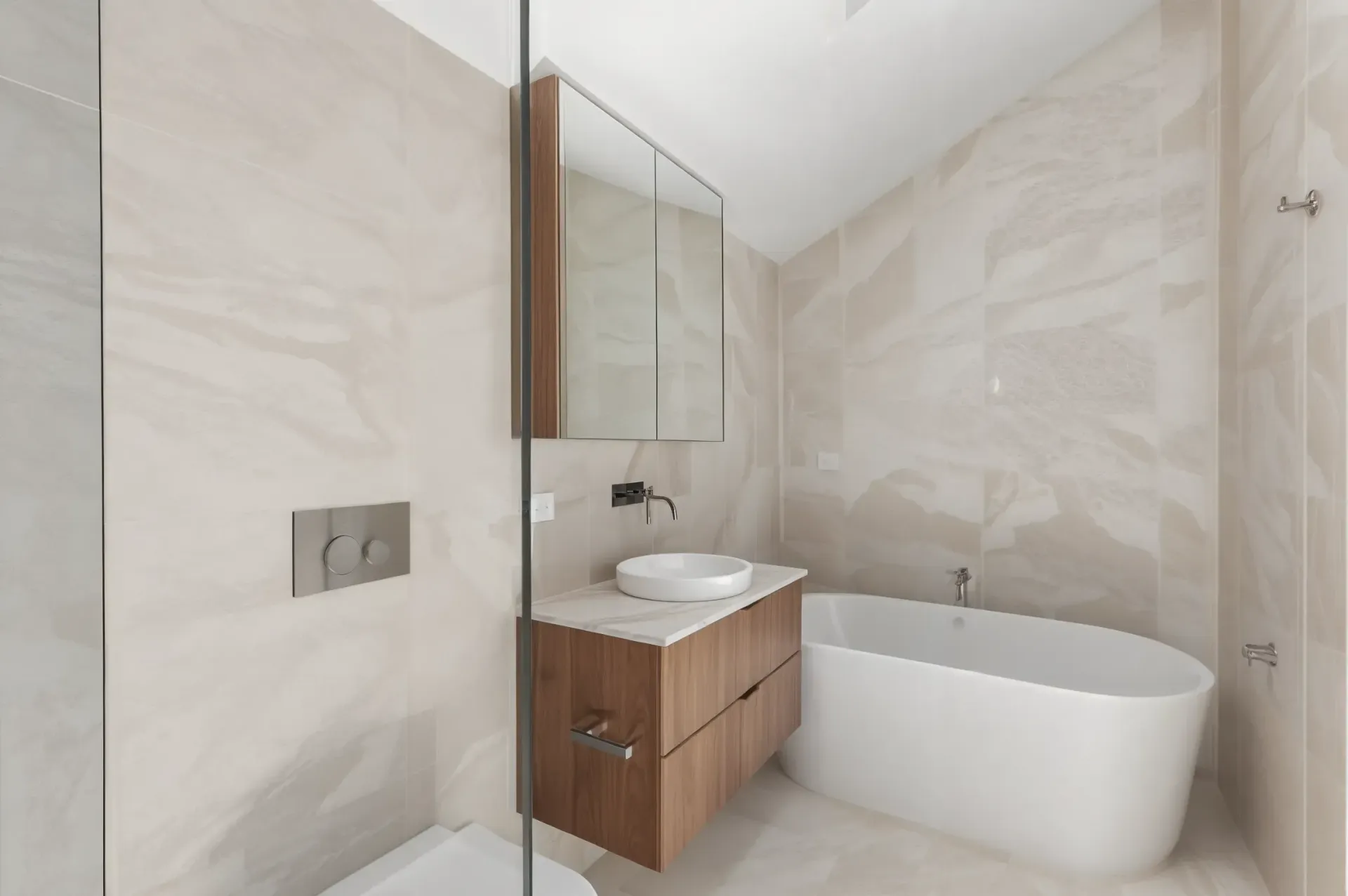 Modern Bathroom with Beige Marble Walls — JDS Kitchens & Detailed Joinery in Albion Park Rail, NSW