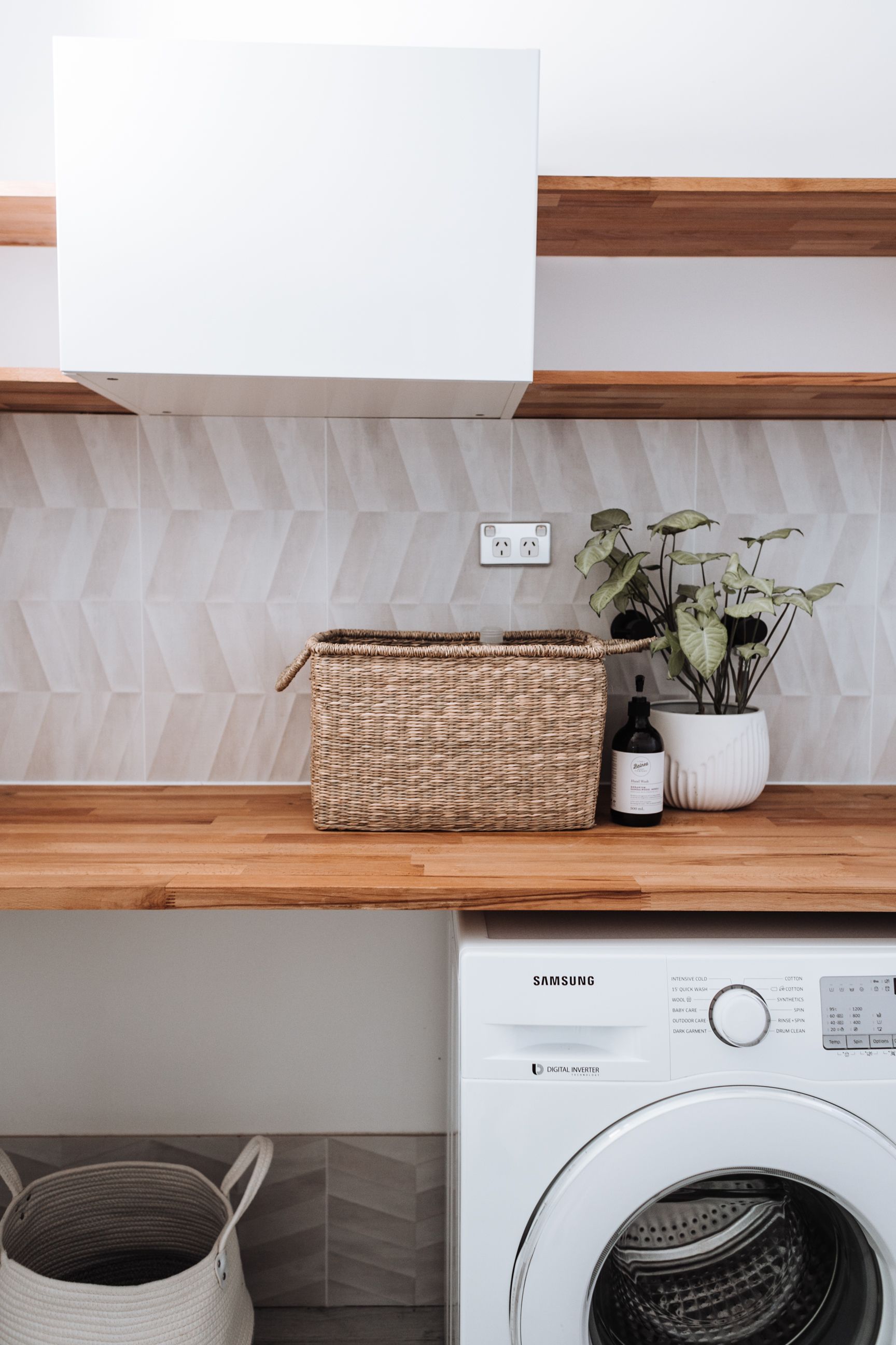 Modern Laundry Room With White Cabinets — JDS Kitchens & Detailed Joinery in Albion Park Rail, NSW