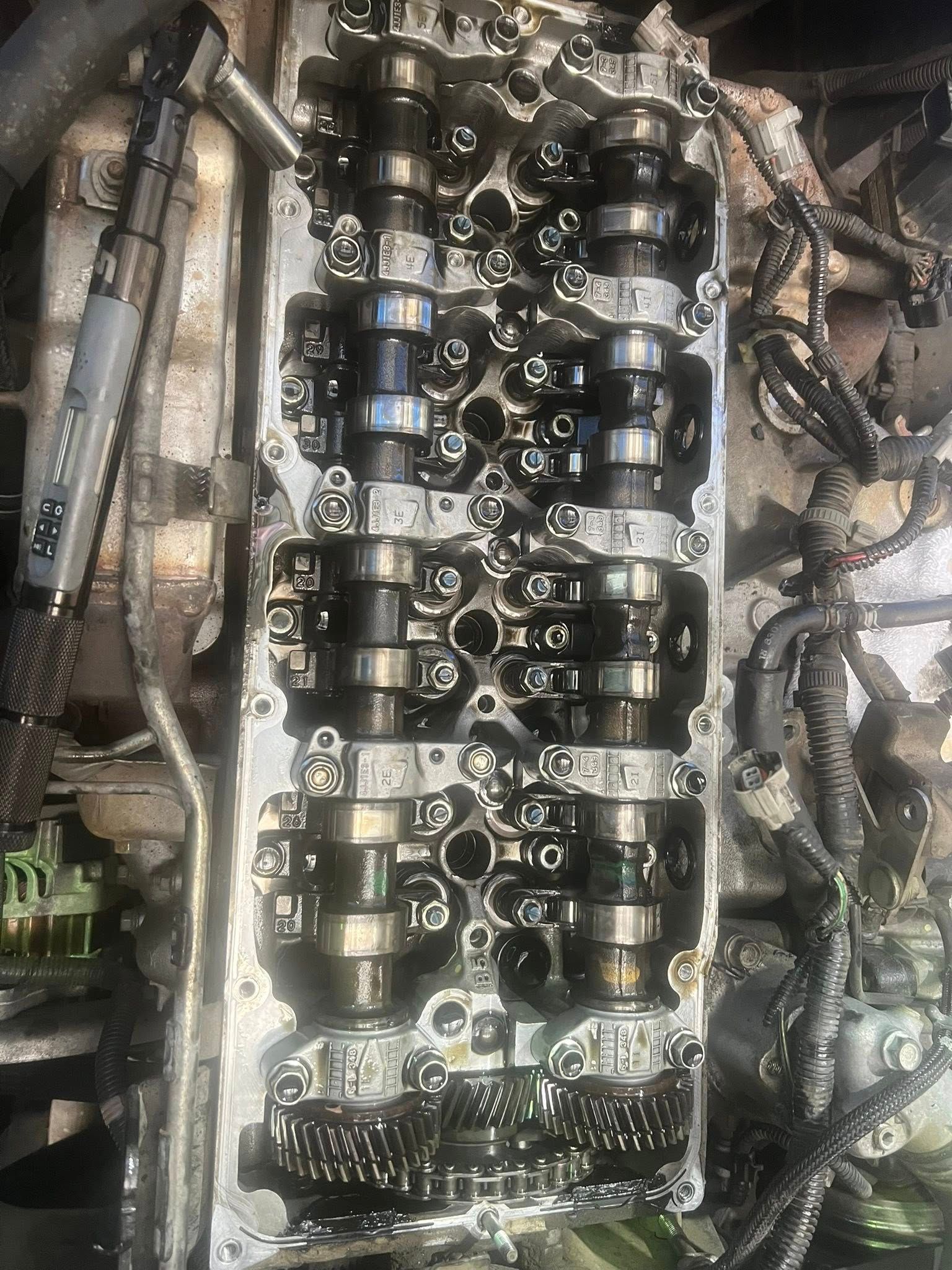 Close-up of an Engine With Exposed Camshafts and Oily Mechanical Parts — North Coast Heavy Diesel In Wauchope, NSW