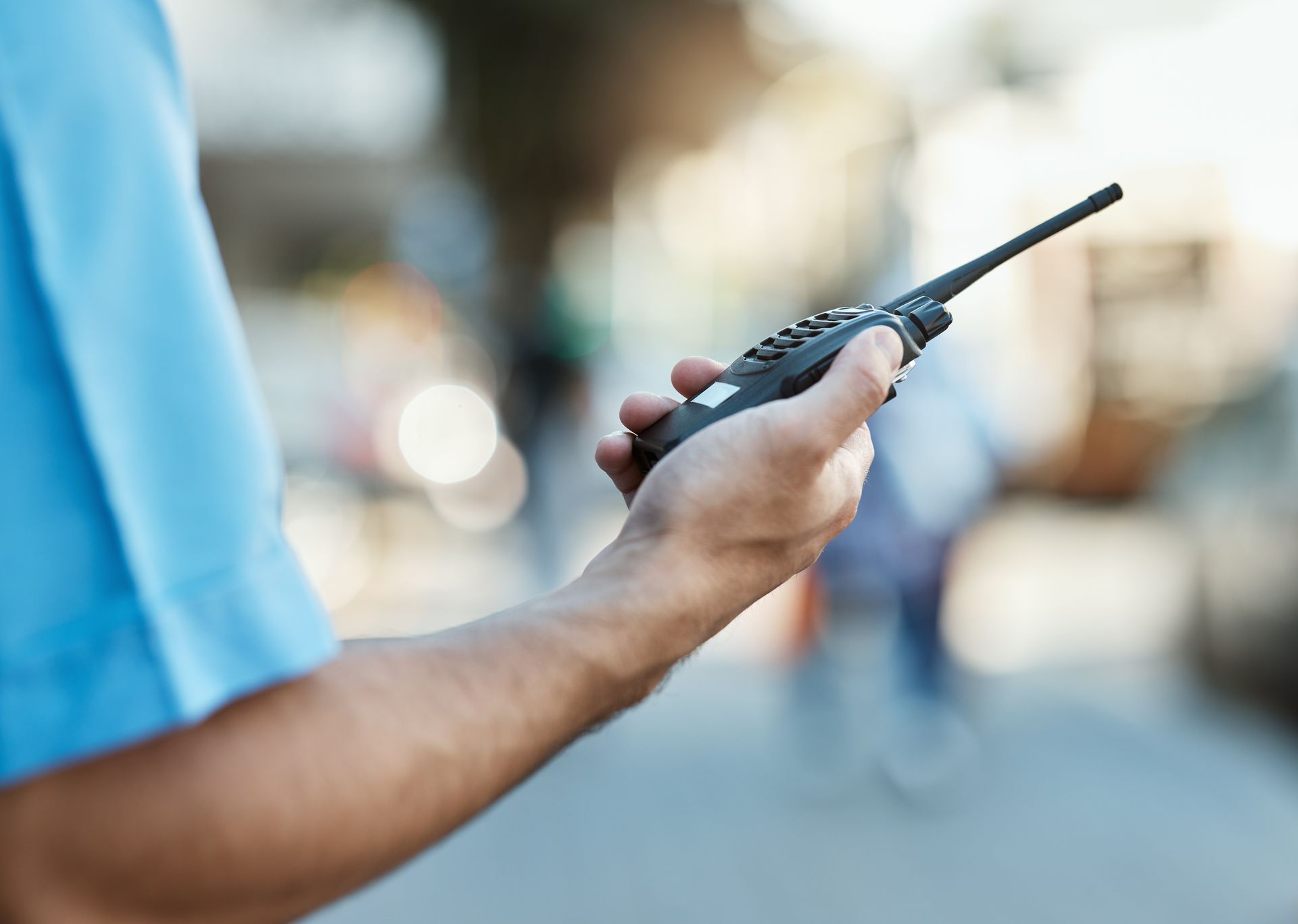 security guard holding walkie talkie