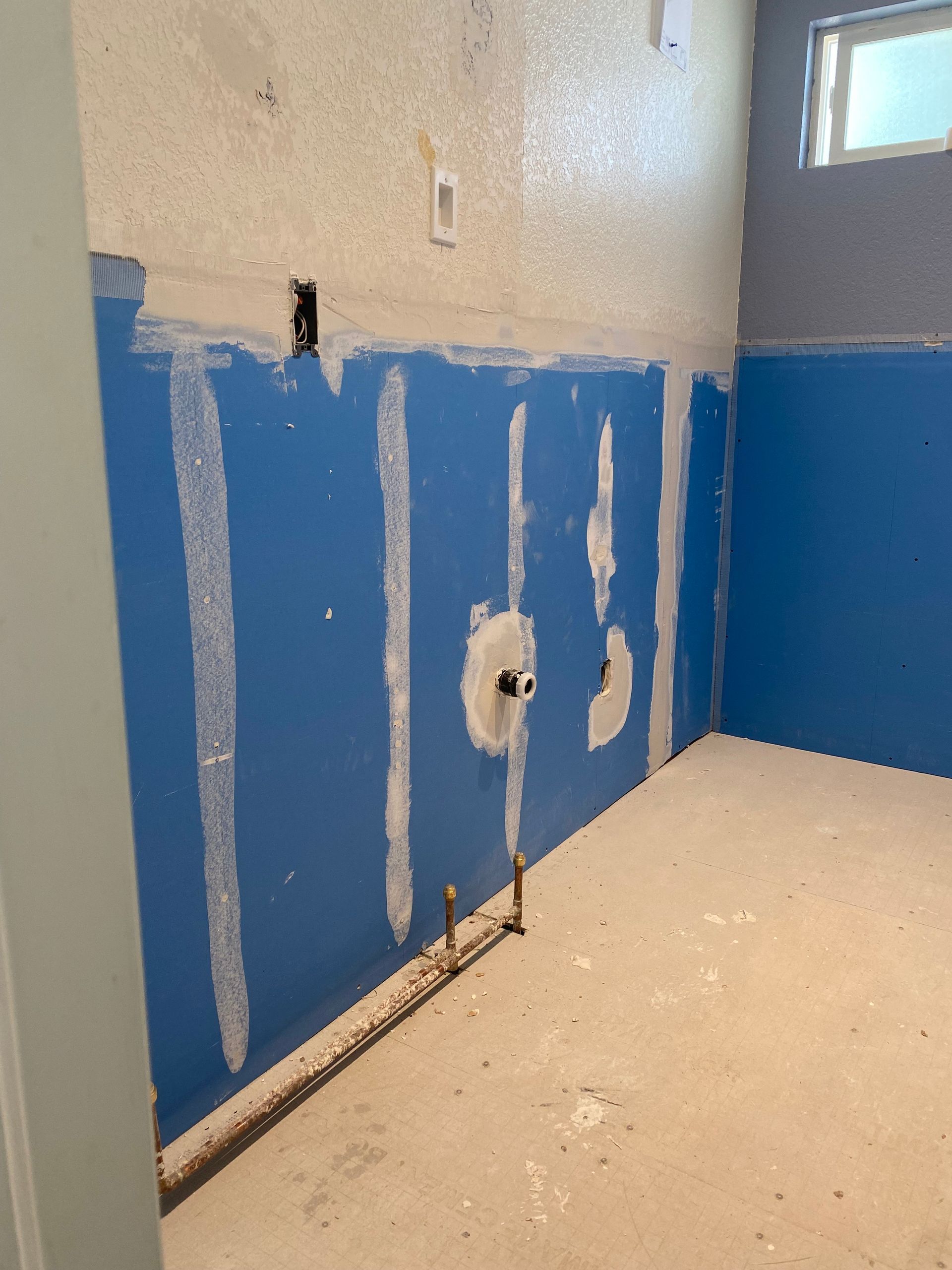 A room with blue walls and a white floor
