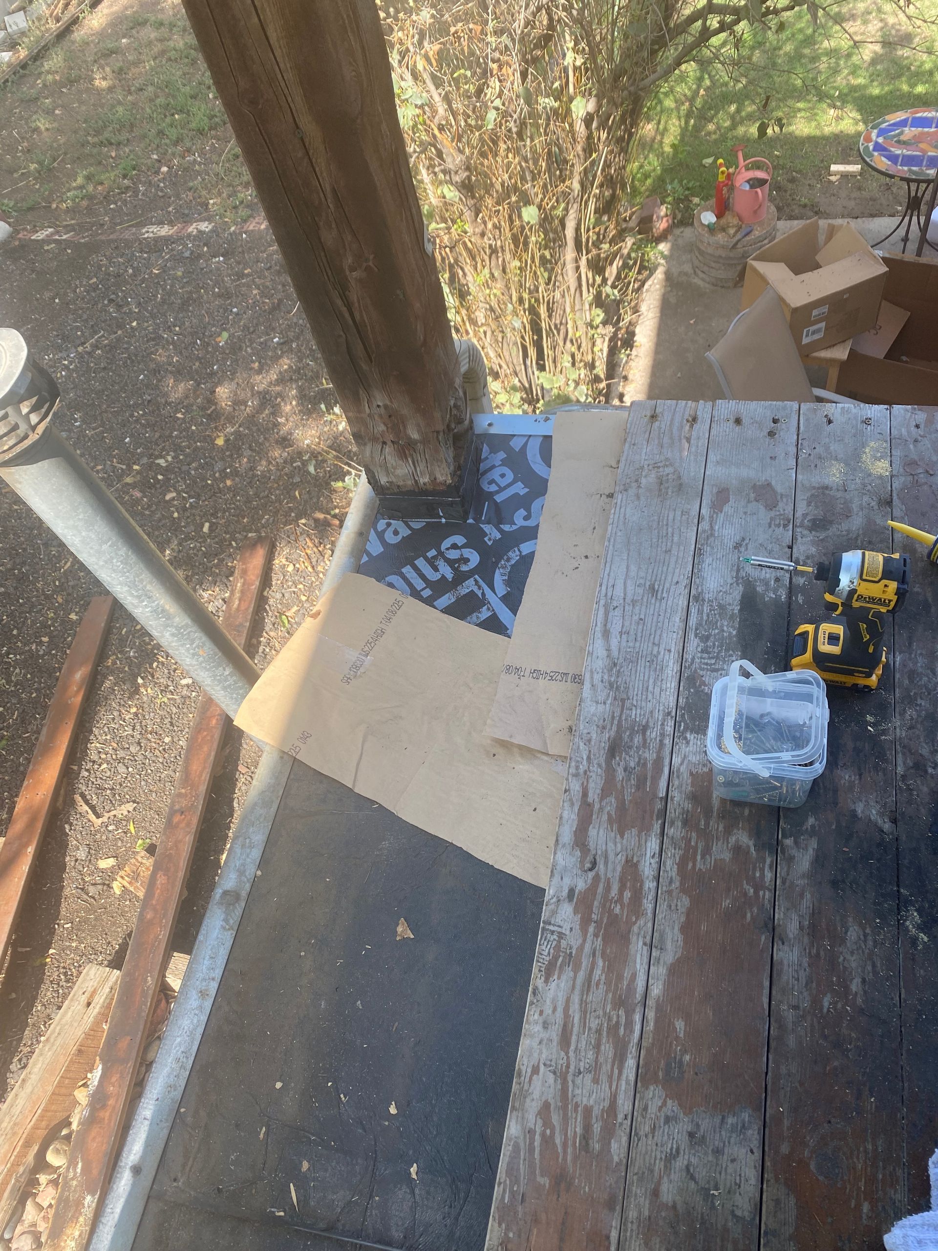 A wooden table with a dewalt tool on it.