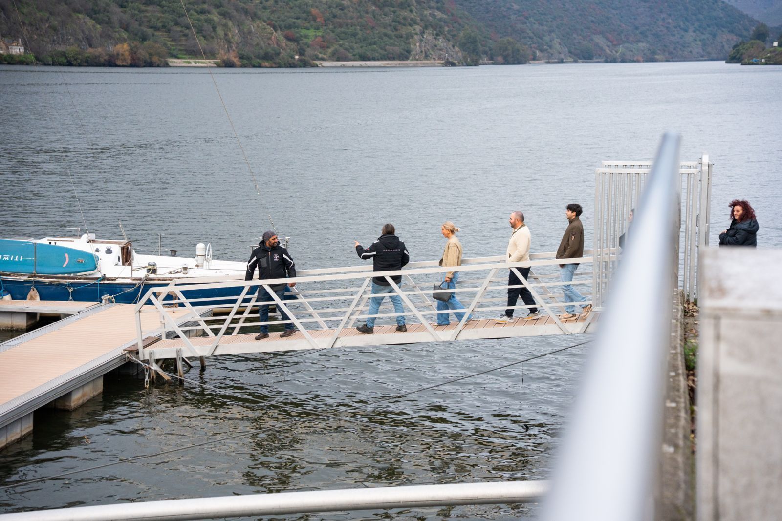 Guests enjoying a social atmosphere and panoramic views on a shared Douro River cruise.