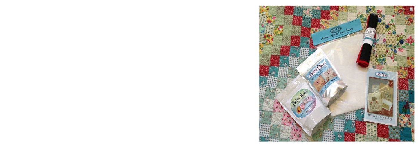 Colorful patchwork quilt with sewing supplies, fabric pieces, and a small bottle arranged on top