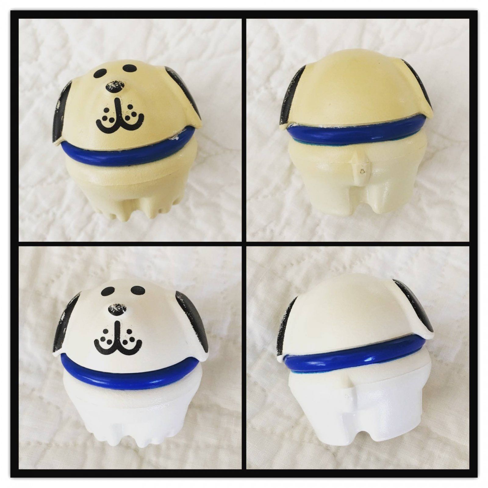Four views of a small cream-and-blue toy with a black anchor face design, shown from front, back, and sides
