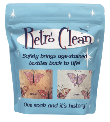 Retro Clean detergent pouch in blue, with tagline about safely restoring age-stained textiles.