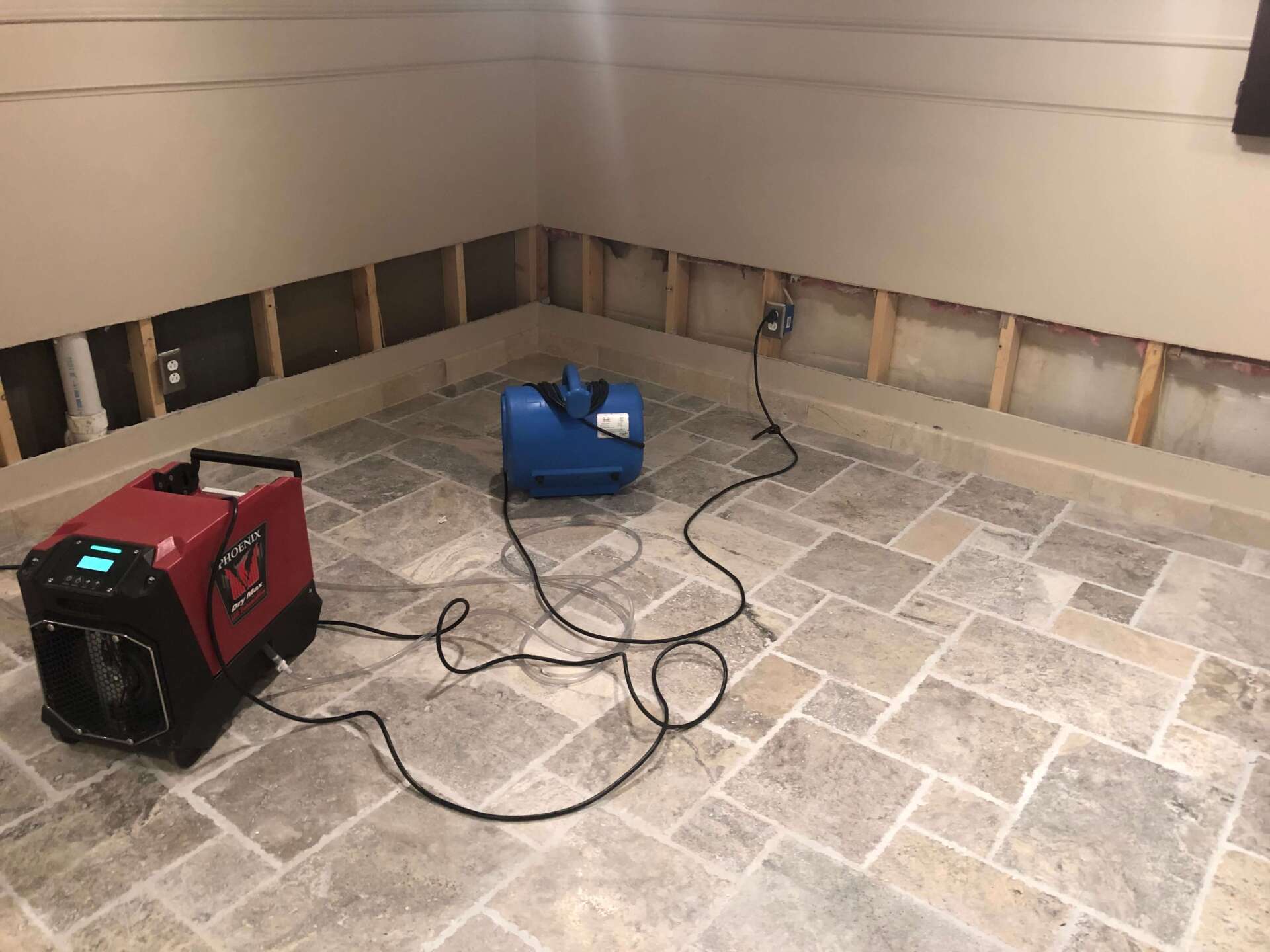 A machine is sitting on a tiled floor in a room.