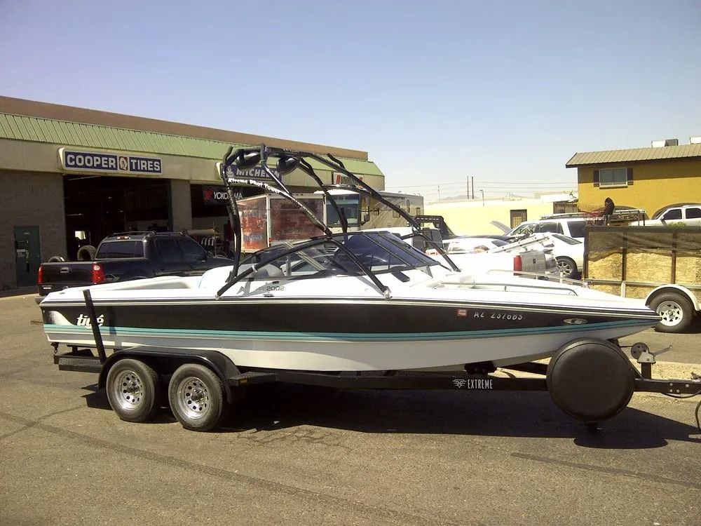 A boat is parked in front of a building that says cooper brothers