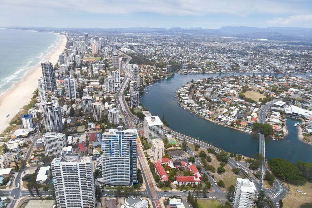An Aerial View of a City With a River Running Through It — Killiby & Co Roofing Pty Ltd in Nerang, NSW