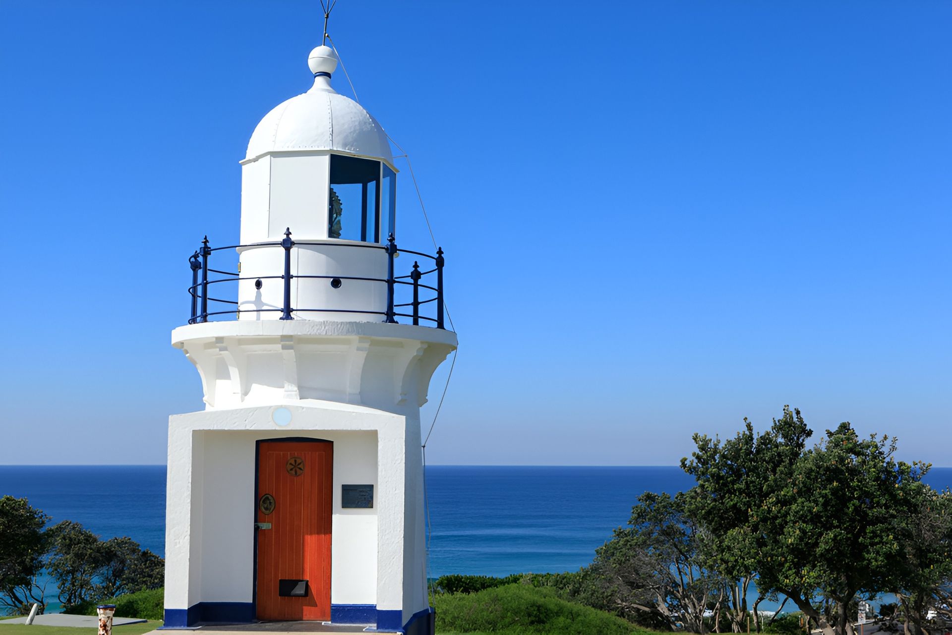White Lighthouse With Orange Door — Killiby & Co Roofing Pty Ltd in Northern Rivers, NSW