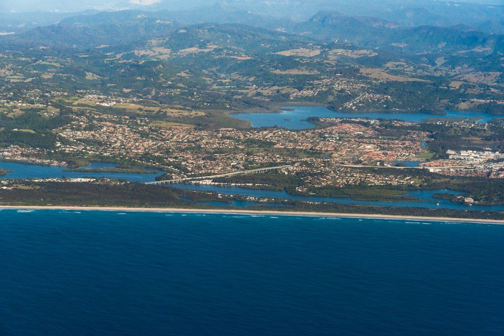 Aerial View Of A Beautiful Beach — Roof & Gutter Repairs in Banora Point, NSW