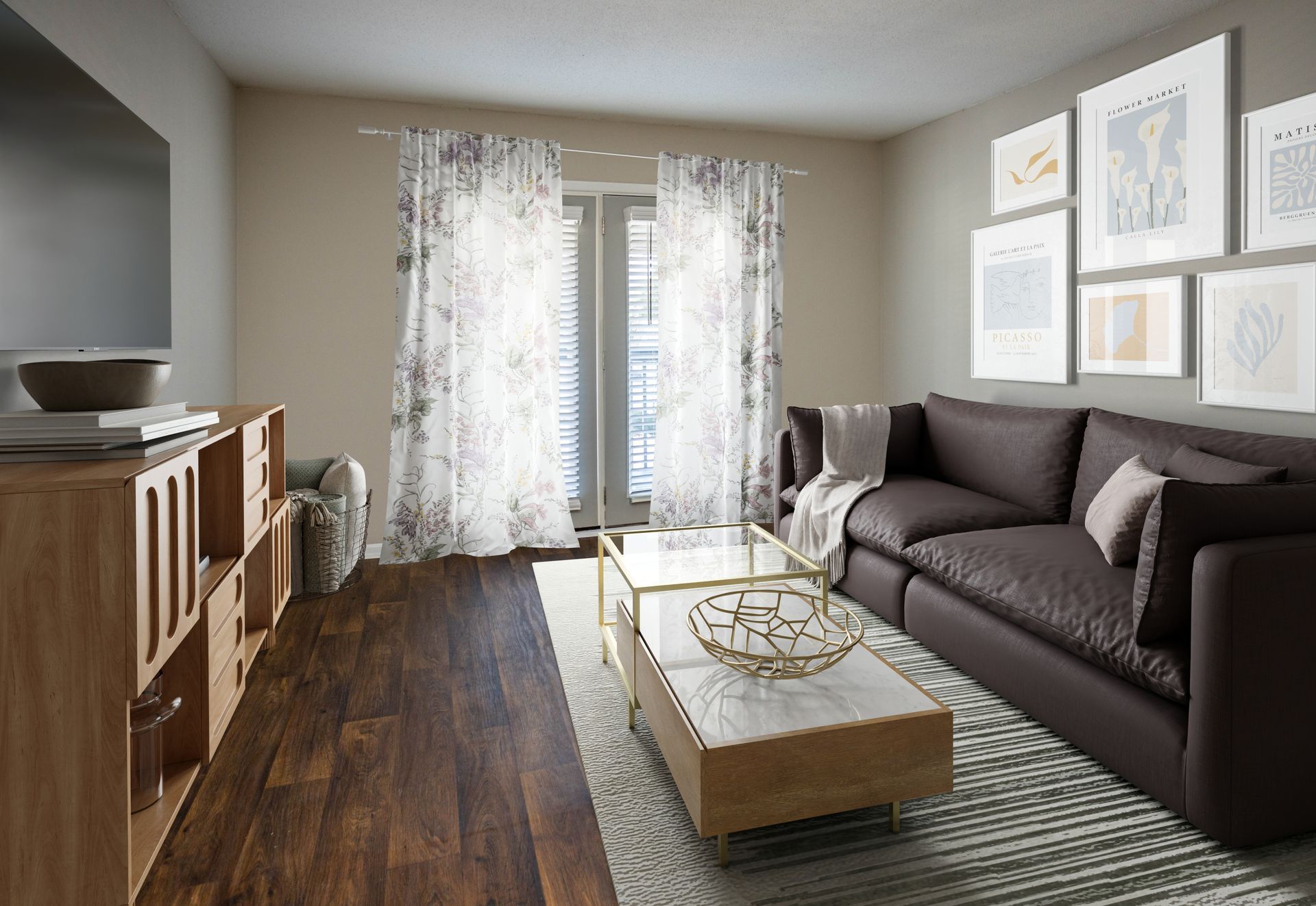 A modern living room with a brown sofa, wooden media console, coffee table, and gallery wall against a light grey wall.
