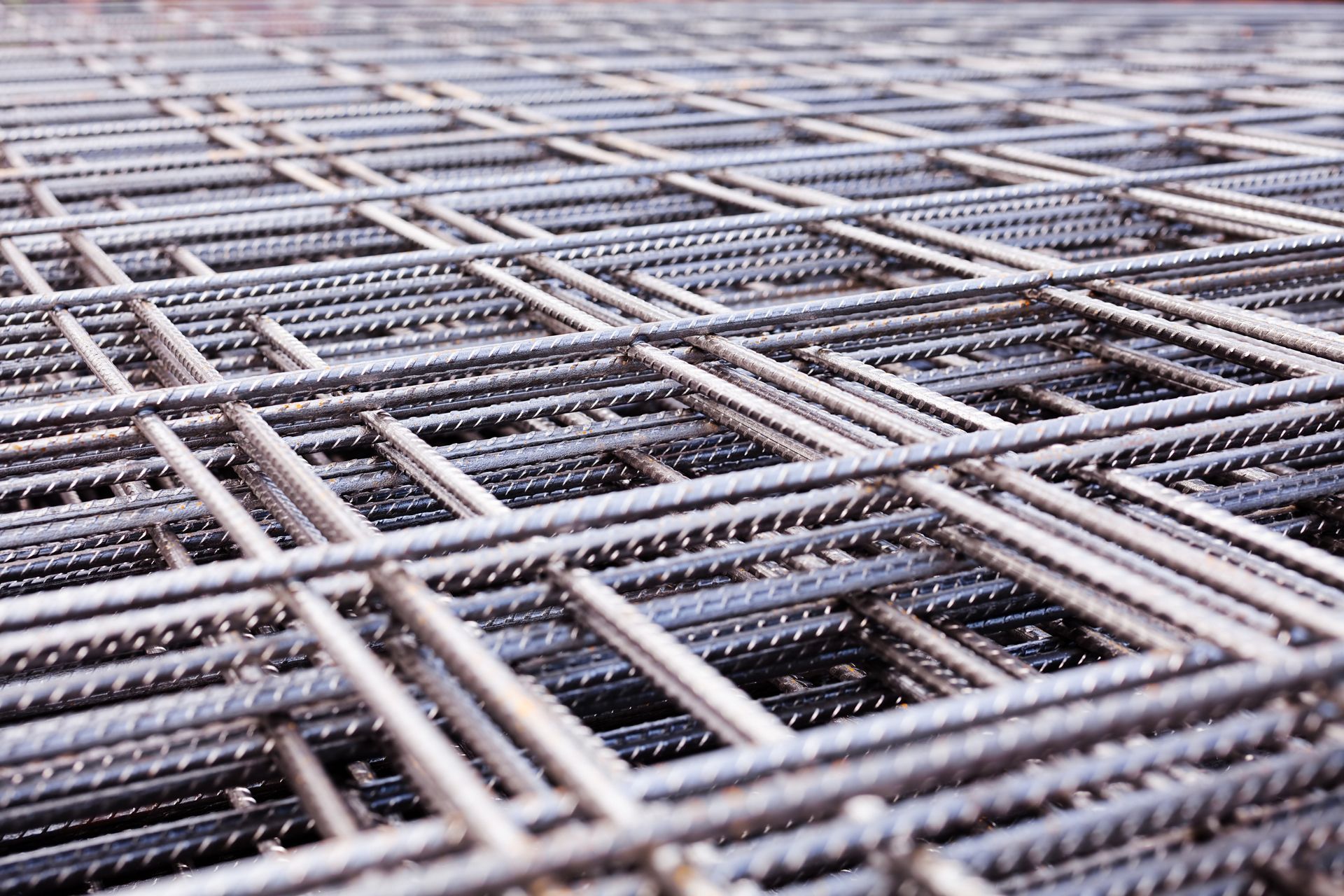 A close-up of a pile of steel construction reinforcement.