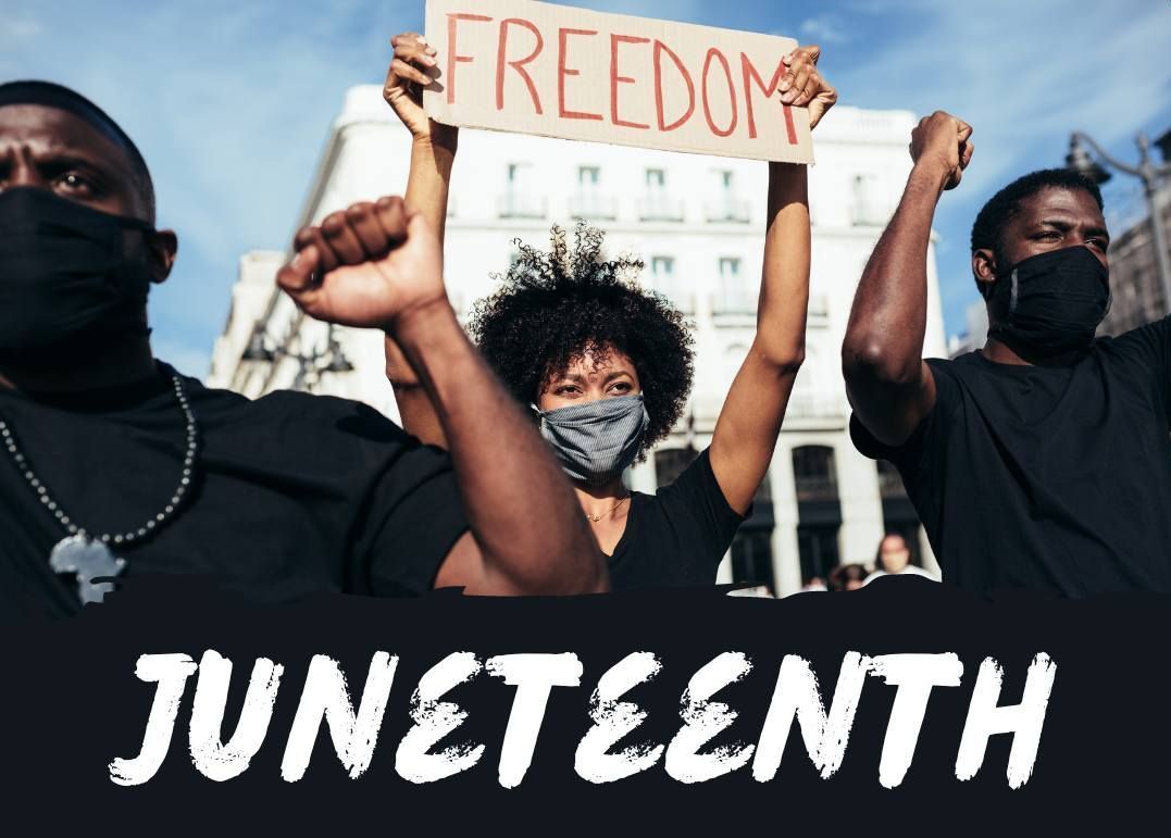 A group of people holding up a sign that says freedom
