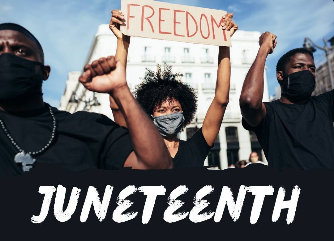 A group of people holding up a sign that says freedom