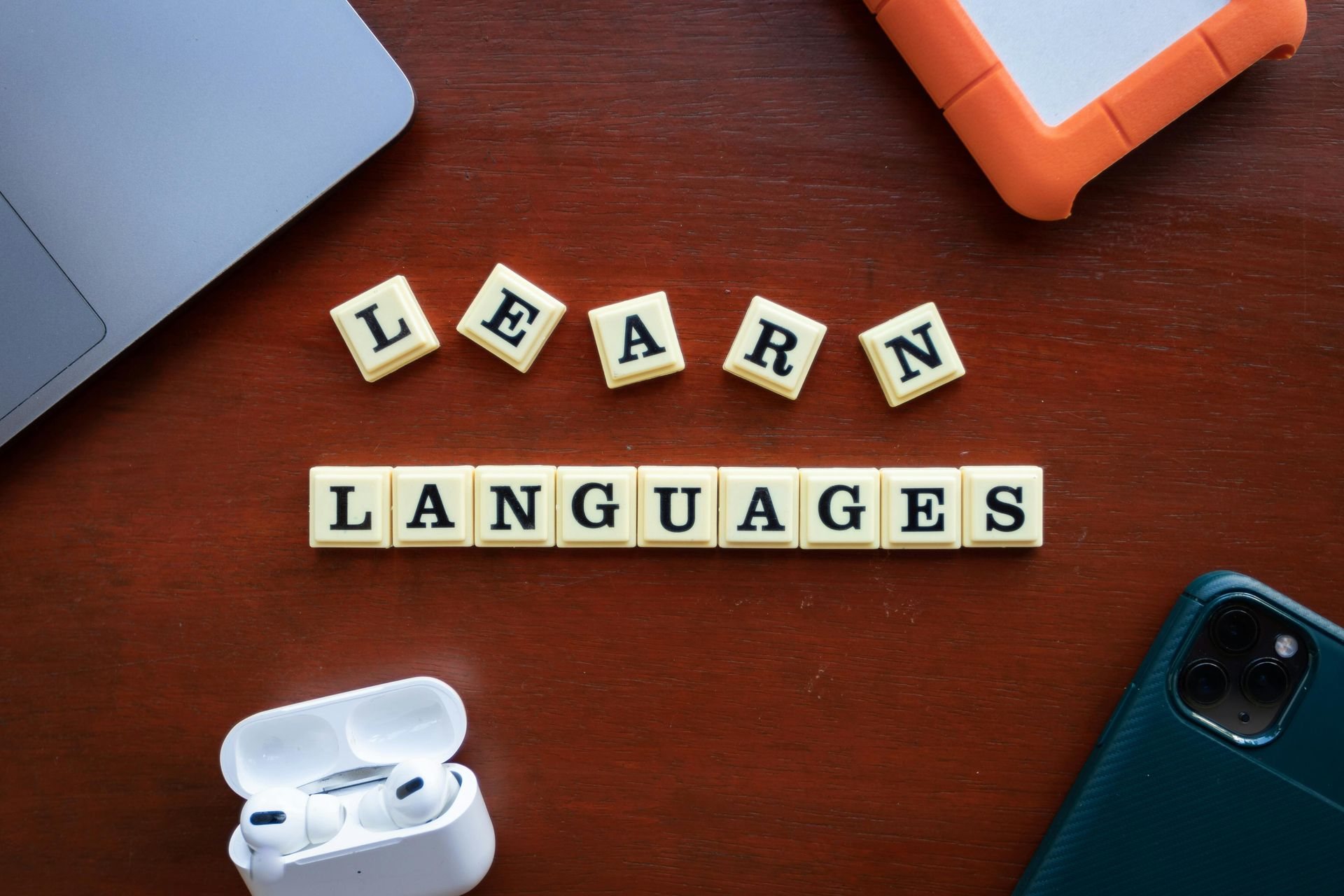 Tiles on a table that say Learn Languages