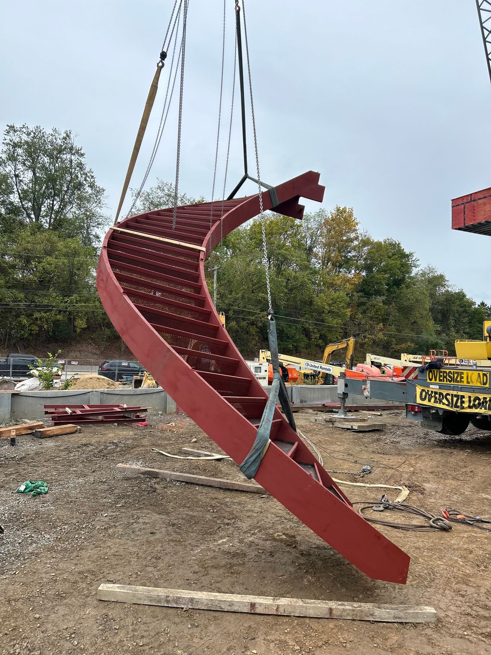 transporting curved steel staircase with a crane
