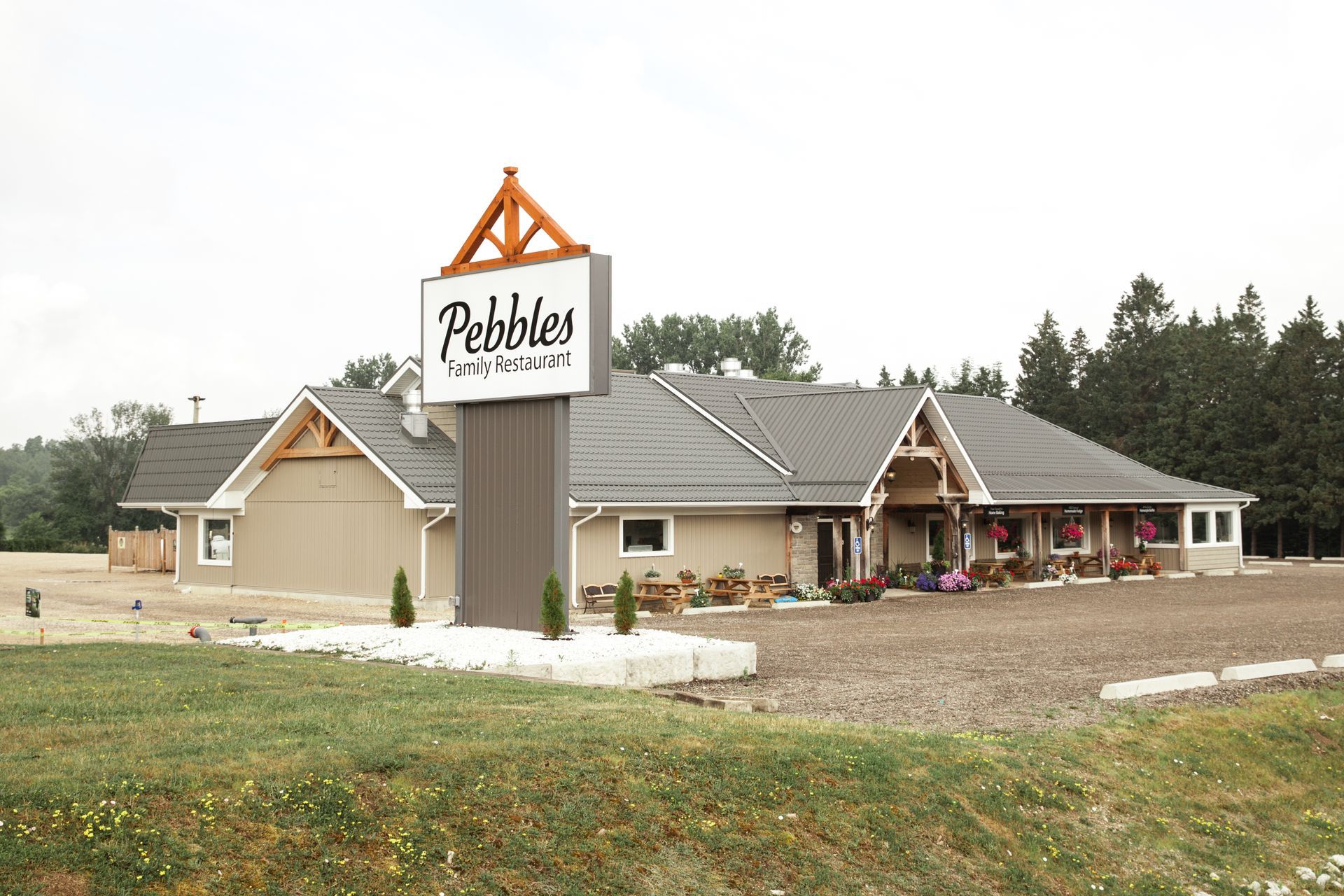 A large building with a sign that says pebbles restaurant