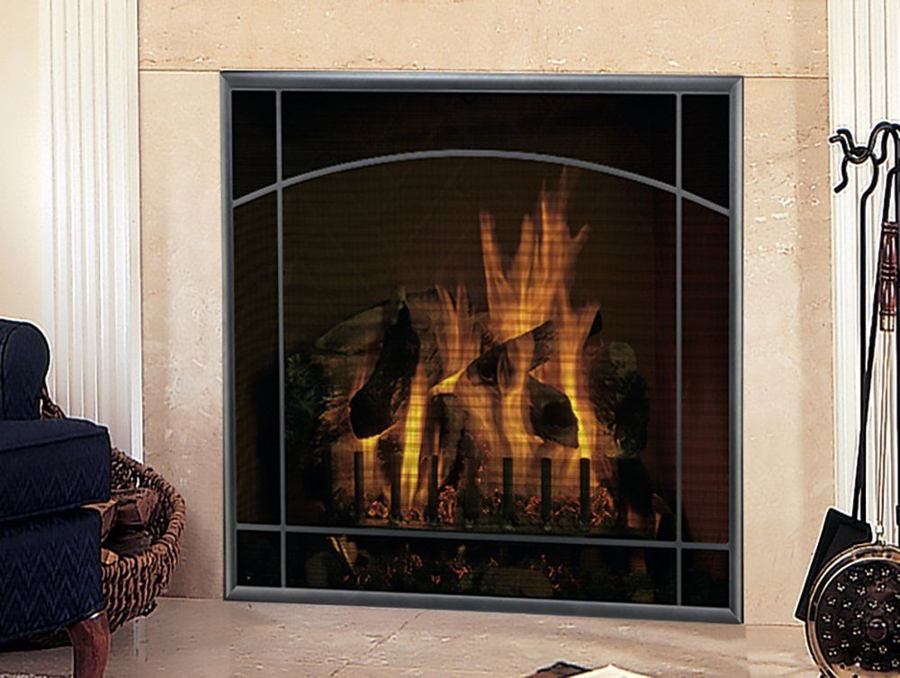 Fireplace with metal screen, flames, and stone surround.