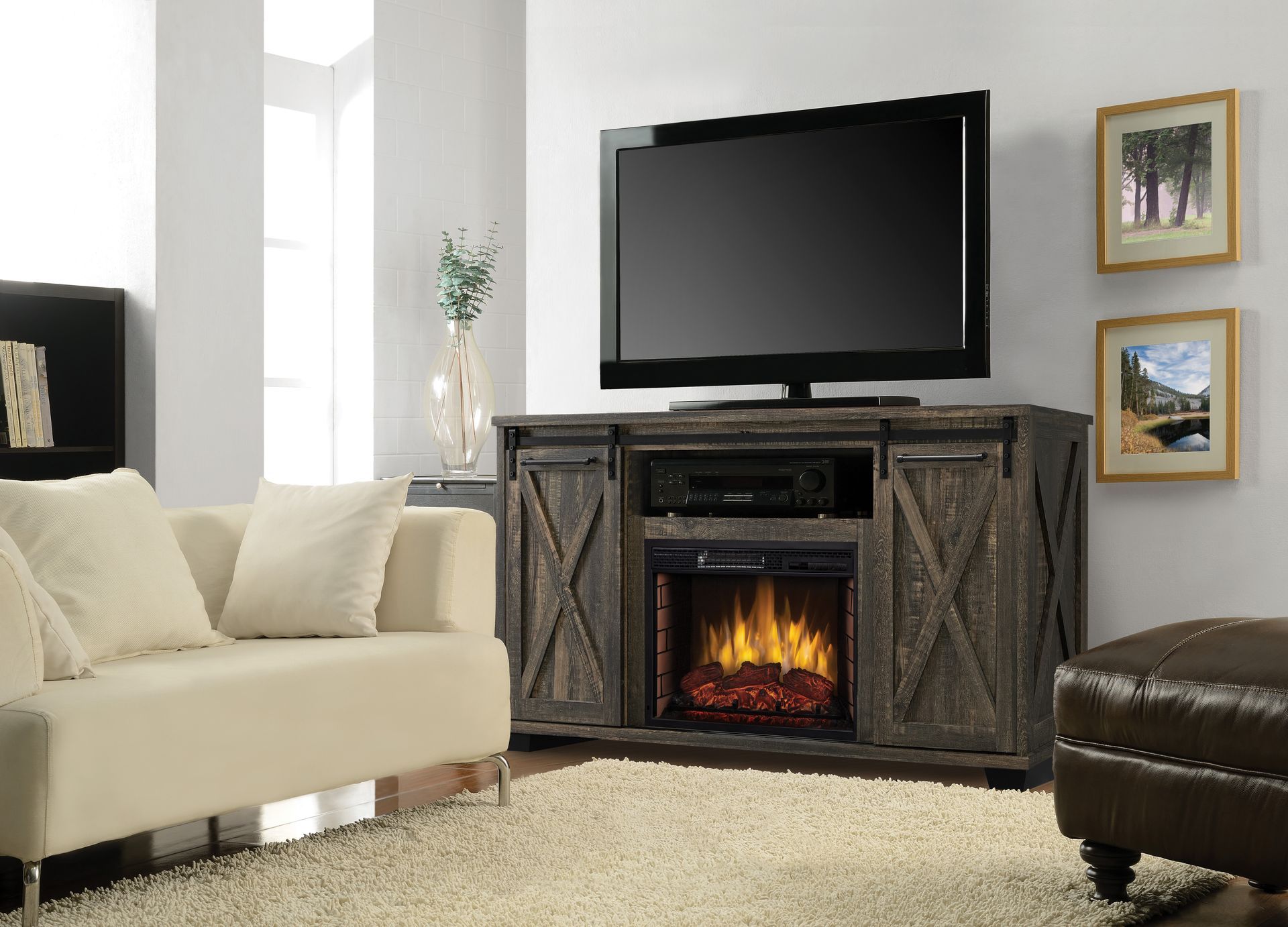 Living room with TV on a rustic wood entertainment center with a faux fireplace.