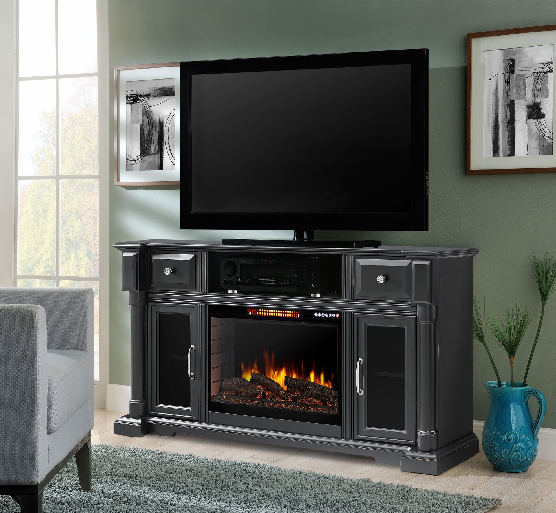 Gray entertainment center with fireplace, TV, and framed art.