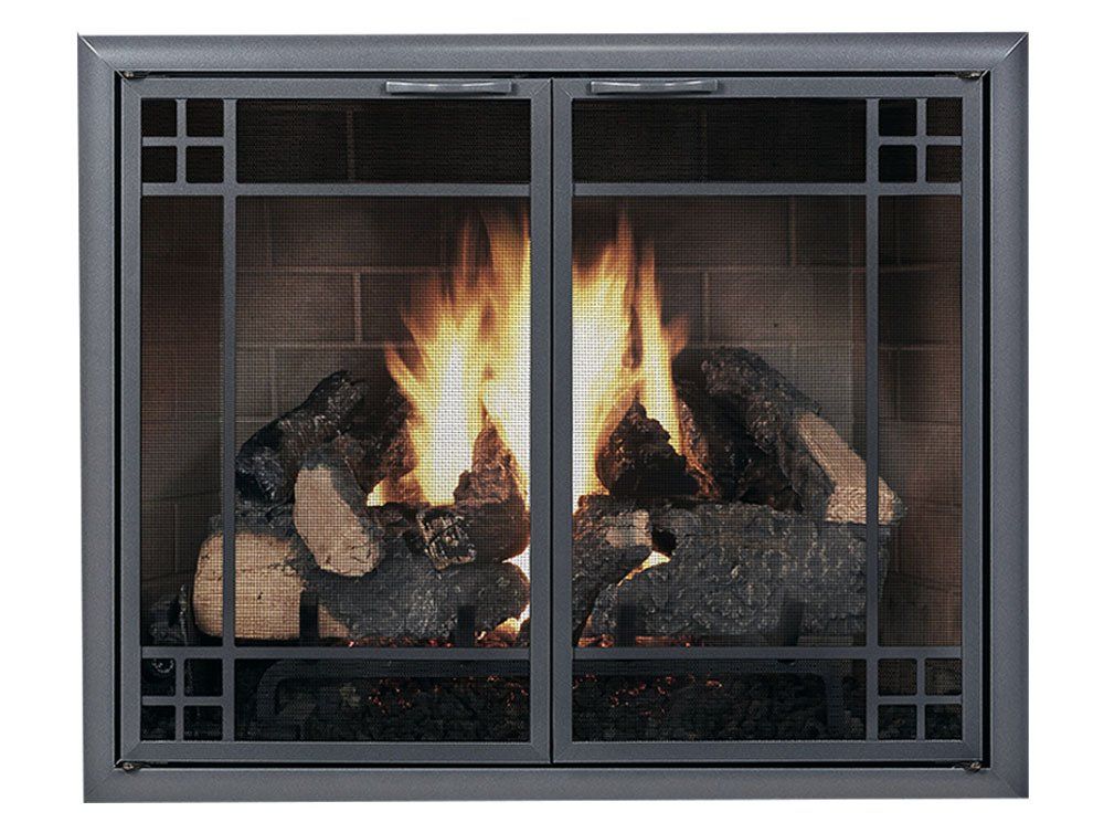 Fireplace with burning logs, behind a dark metal screen door with a geometric design.
