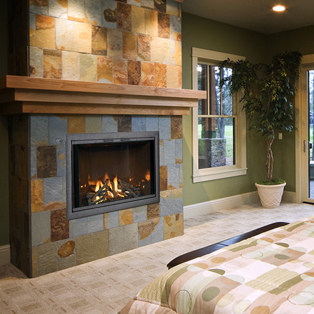 Fireplace with stone tile surround, wood mantel, flames, and green walls.