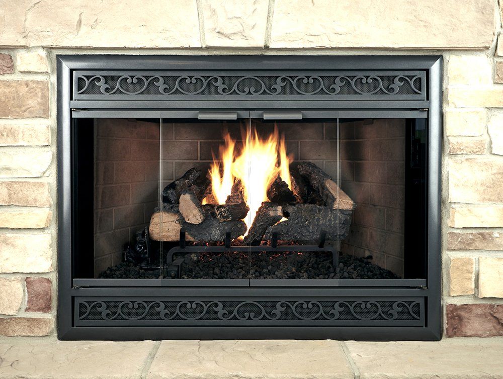 Fireplace with burning logs, black metal frame, and a brick surround.