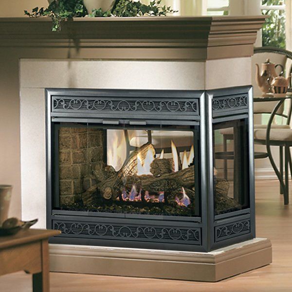 Fireplace with black decorative screen, burning flames, logs, inside a living room setting.