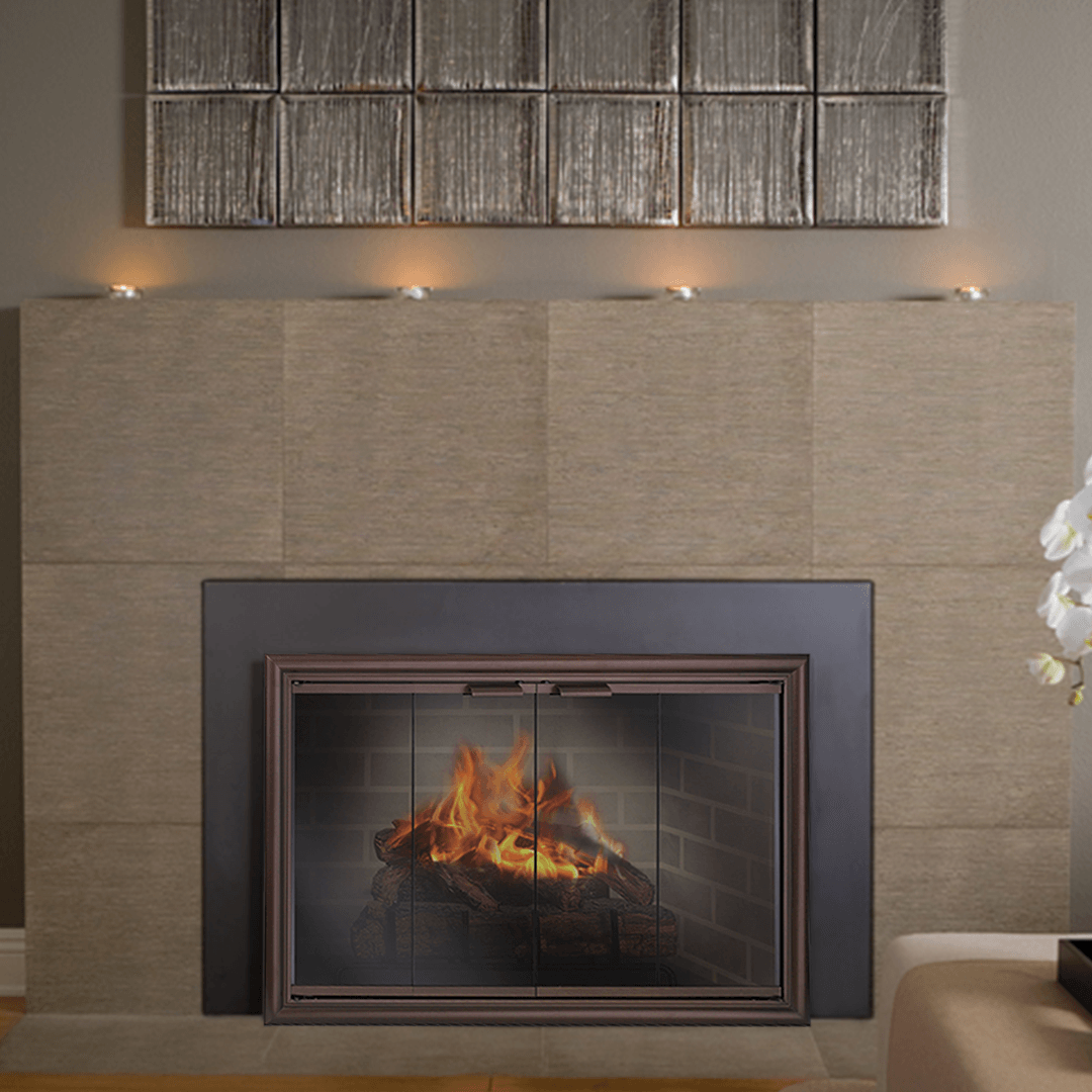 Fireplace with flames behind glass doors, dark metal frame, and tan tile surround.