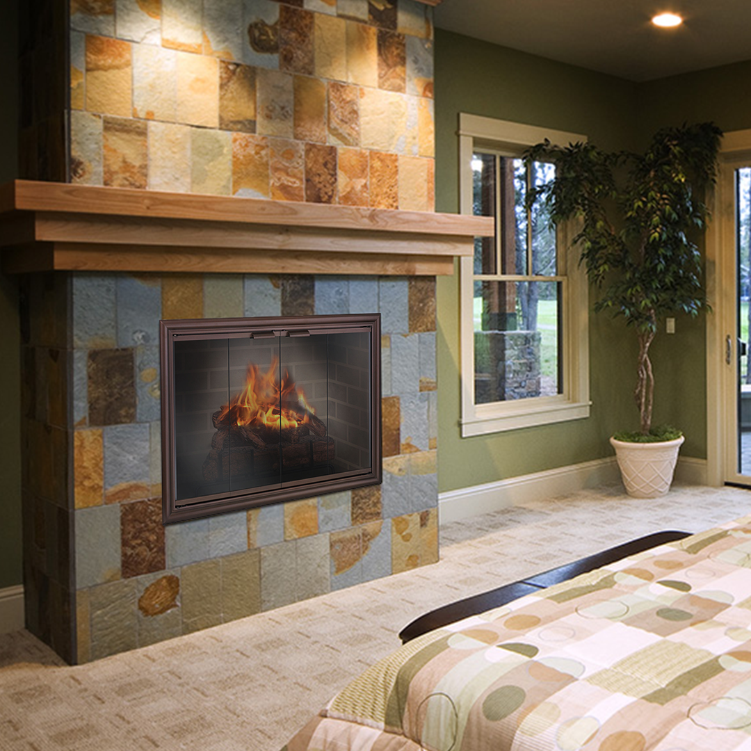 Fireplace with stone tile surround, wood mantel, and a burning fire. Bedroom setting.