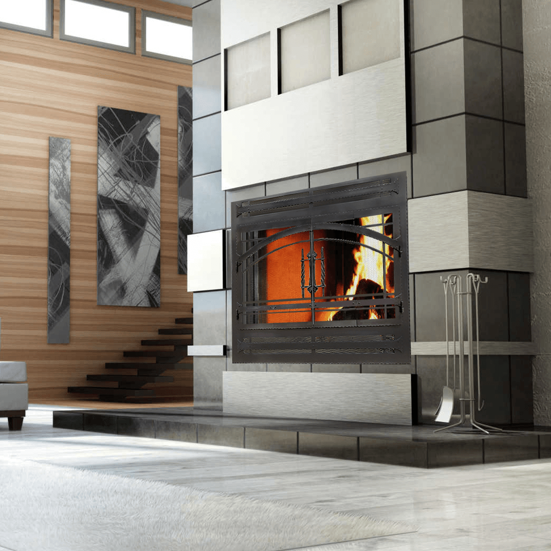 Modern fireplace with black and silver tiles, a burning fire, and a wood-paneled wall.