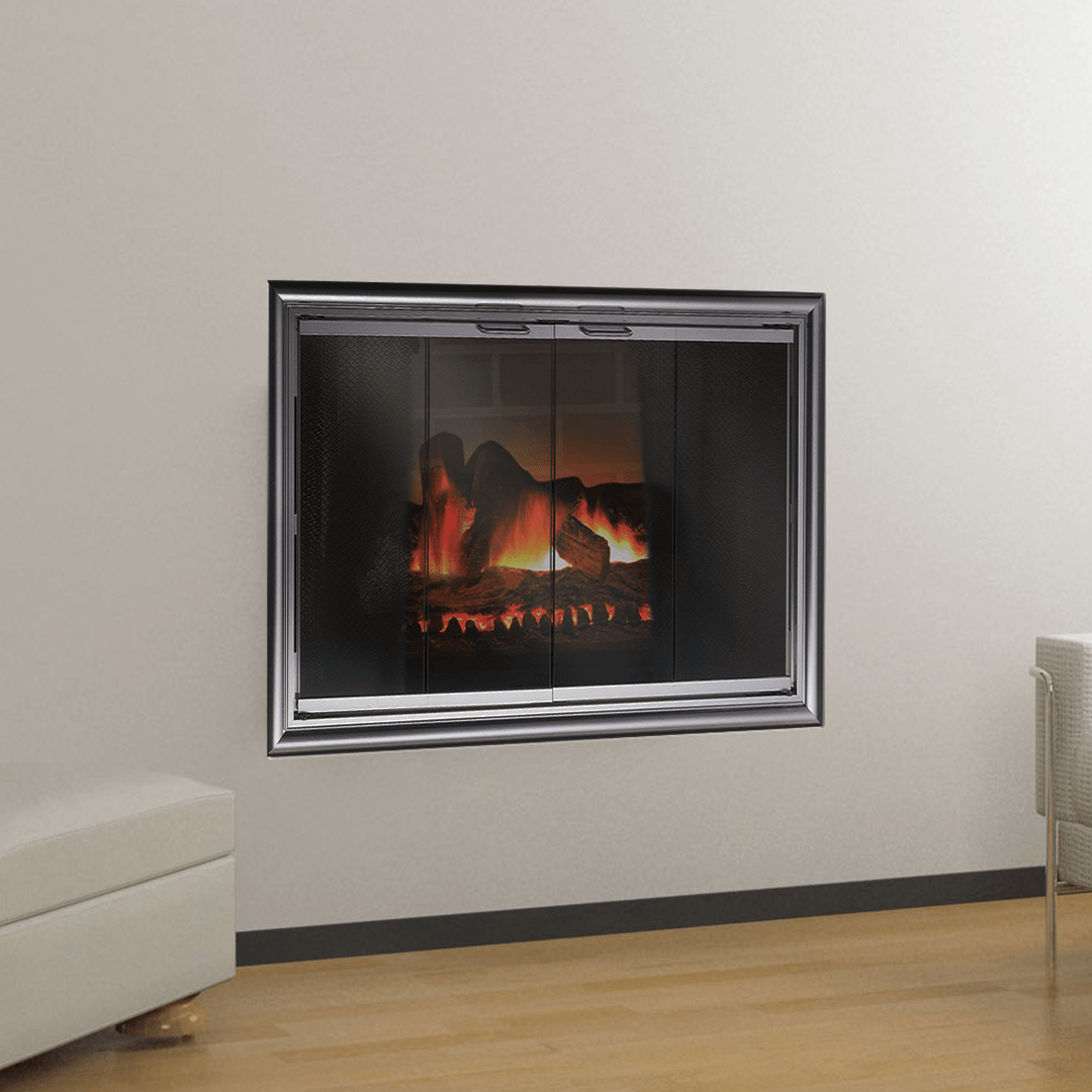 Fireplace set in a white wall with glass doors and a lit fire, reflected in a metallic frame.