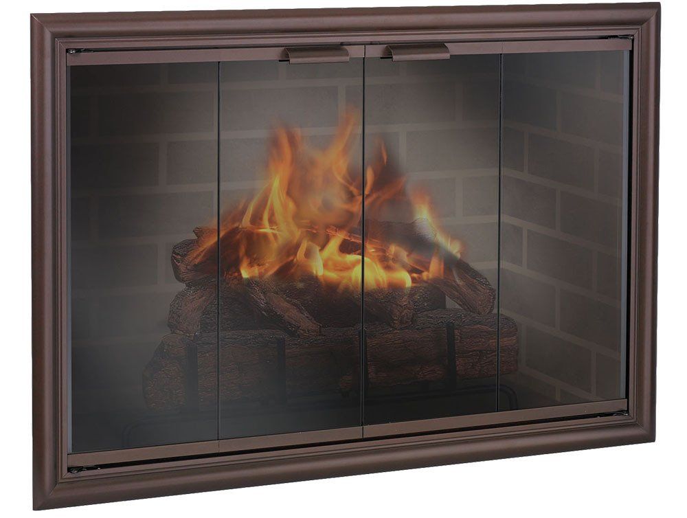 Fireplace with glass doors and burning logs inside a brick enclosure.