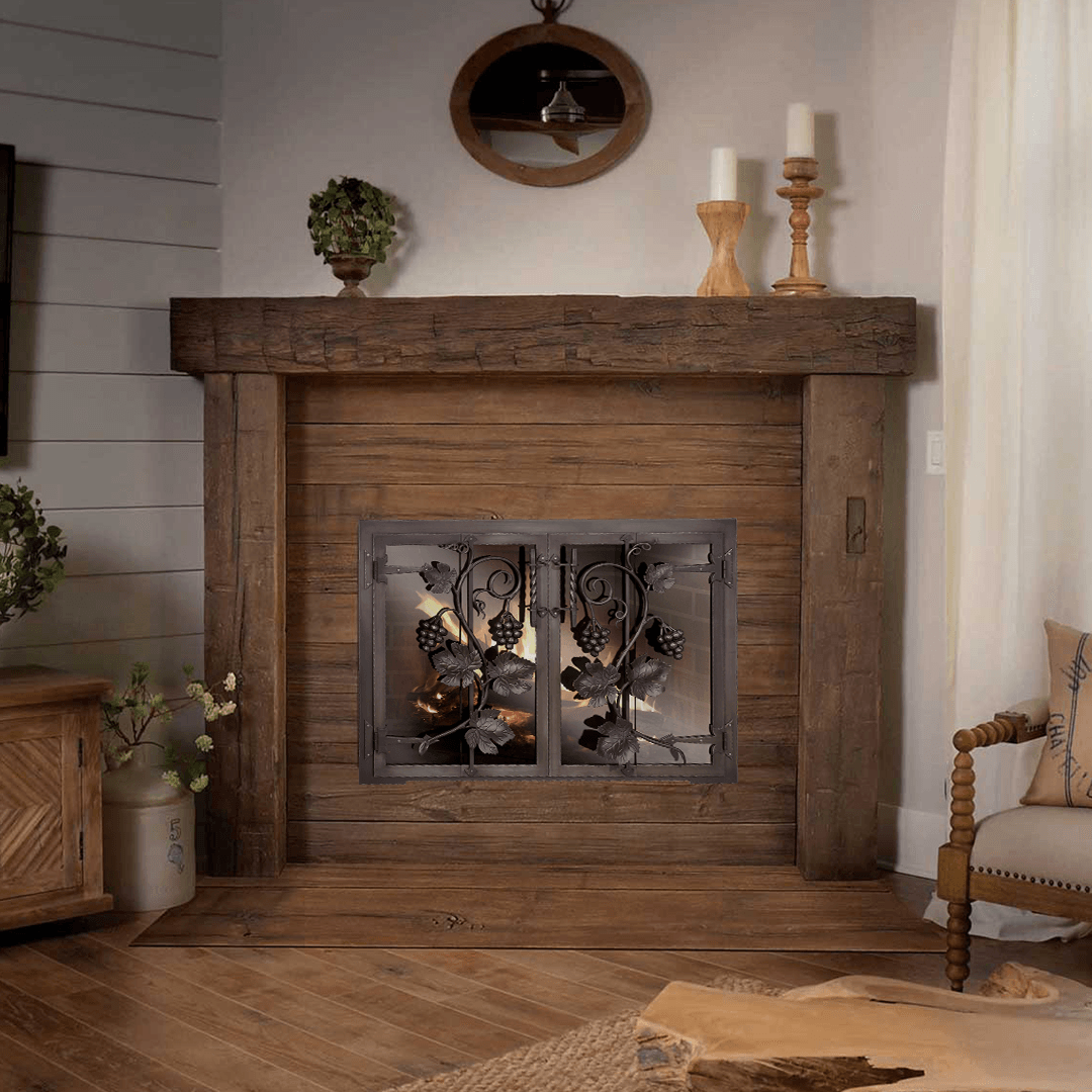 Rustic wooden fireplace with metal screen, candles, and decor in a cozy living room.