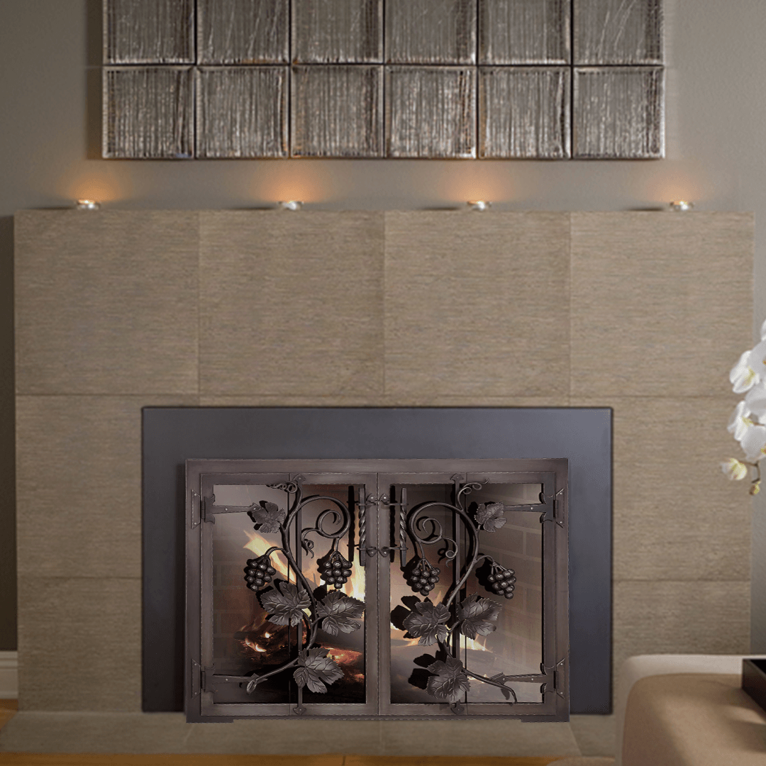 Fireplace with decorative screen, lit candles, and neutral-toned wall tiles, in a warm-toned room.