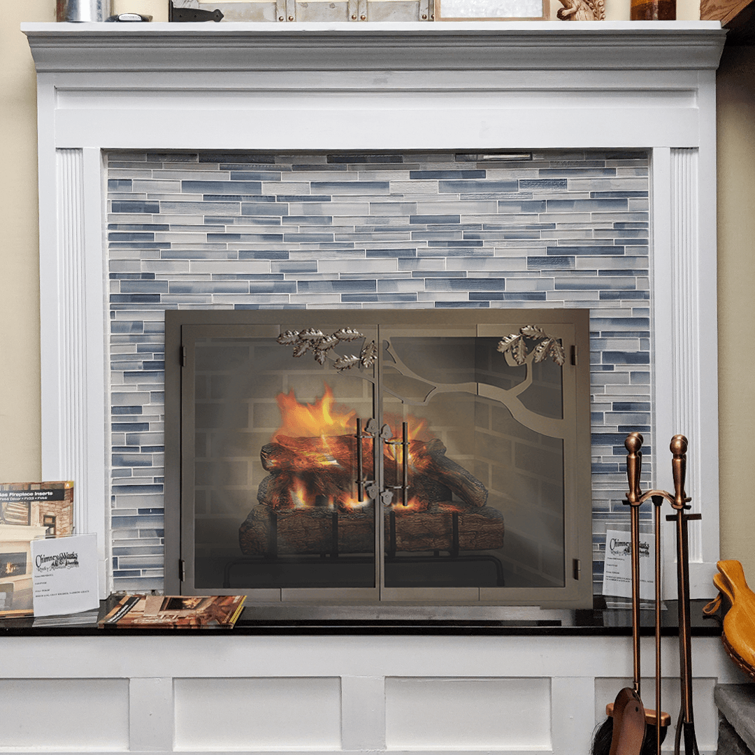 Fireplace with burning fire, blue and white tiled interior, and ornate metal screen.