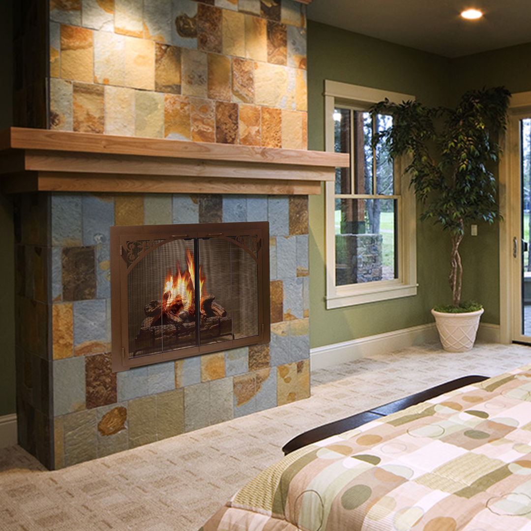 Fireplace with colorful stone tile surround and wooden mantel in a green room.