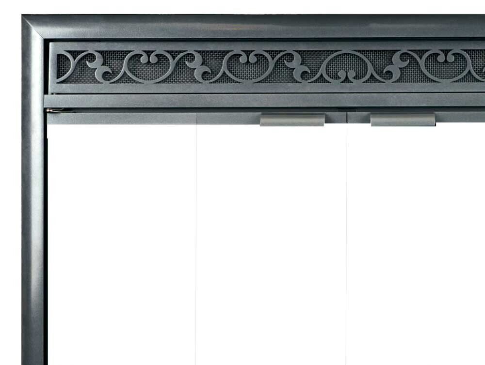 Gray metal fireplace screen with decorative scrollwork detail across the top.