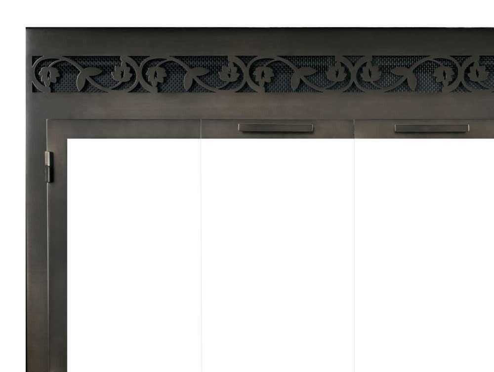 Dark metal fireplace doors with decorative floral trim and three glass panels.