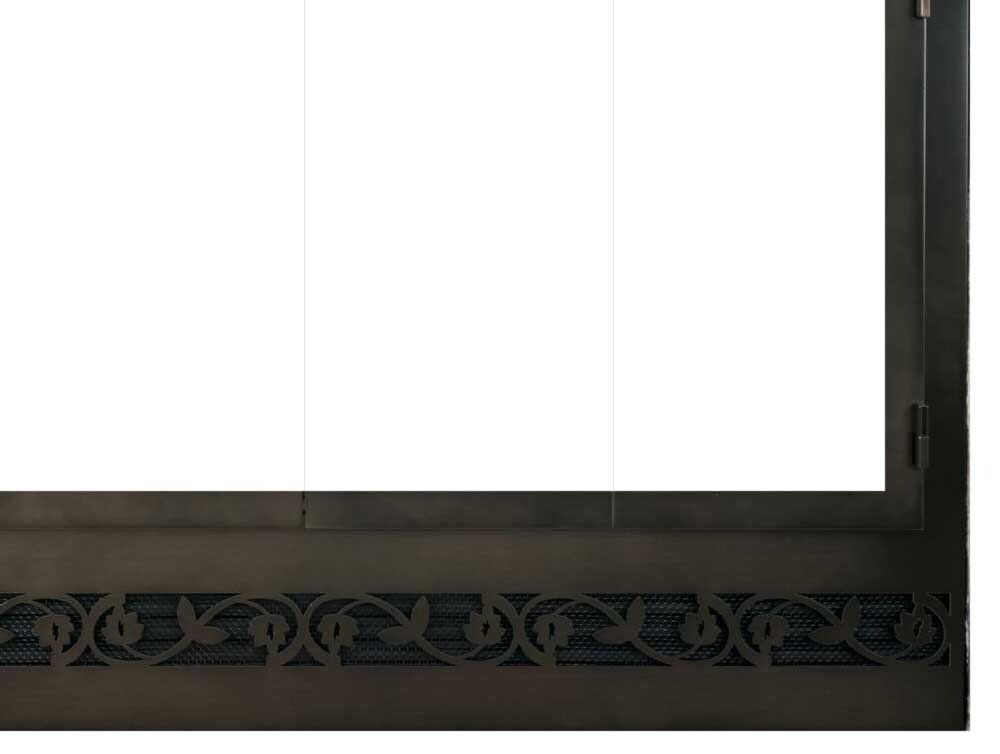 Dark metal fireplace screen with decorative cutout pattern.