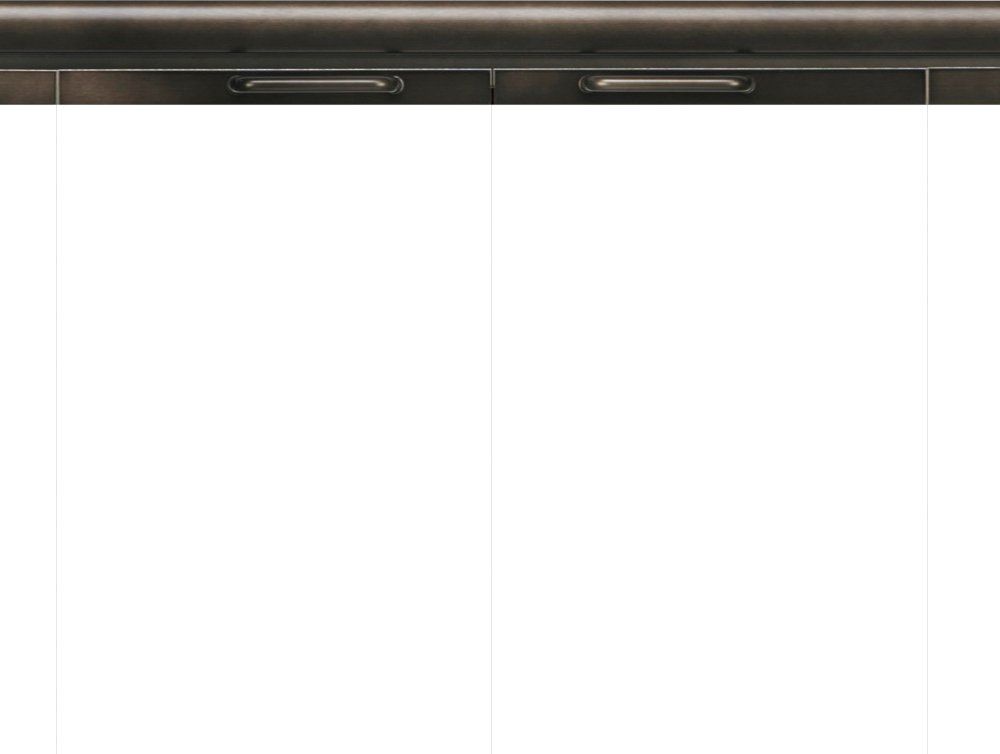 Range hood, bronze finish, above a white surface.
