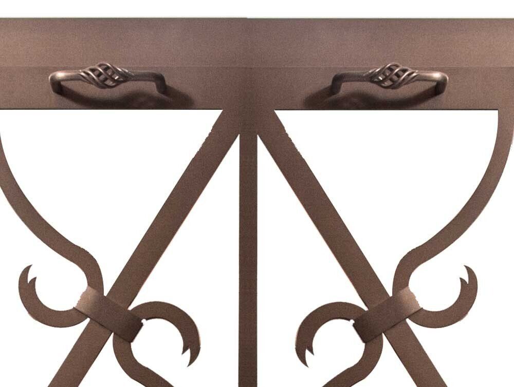 Brown metal gate with decorative handles and stylized design against a white background.